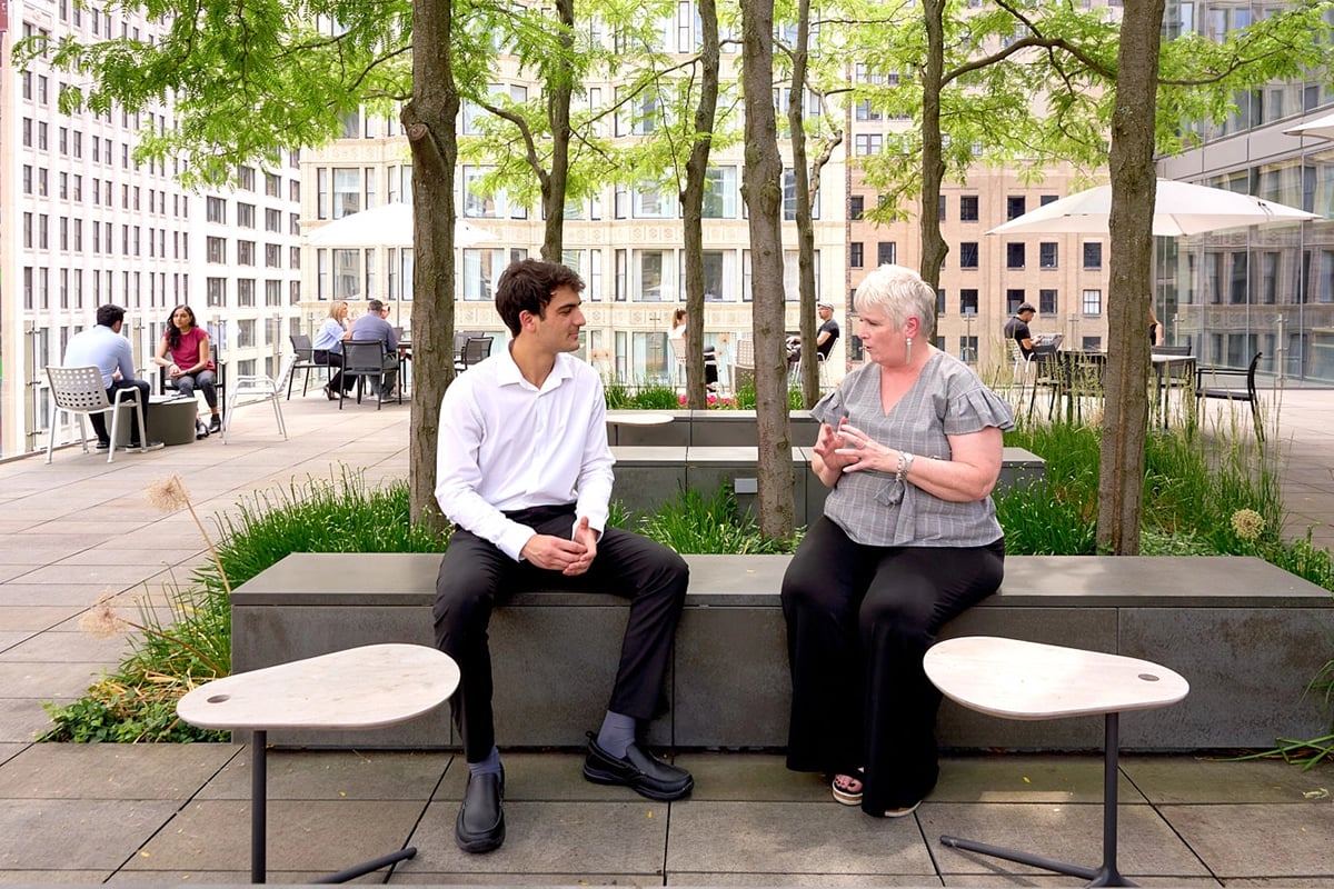 Employees talking on the rooftop patio at the Chicago Morningstar office.