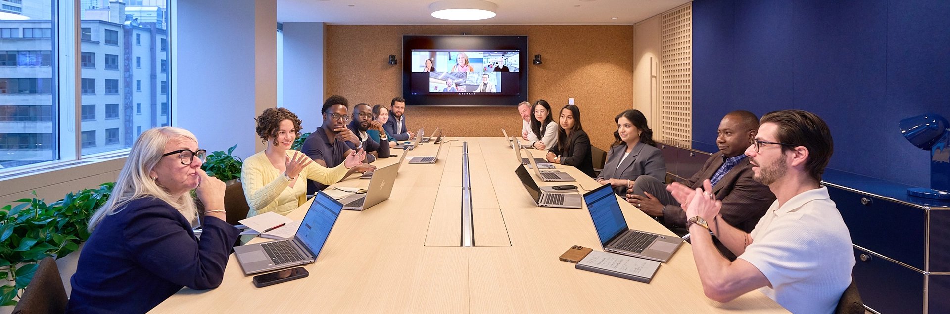 Employees discussing plans around a conference table at a Morningstar office.
