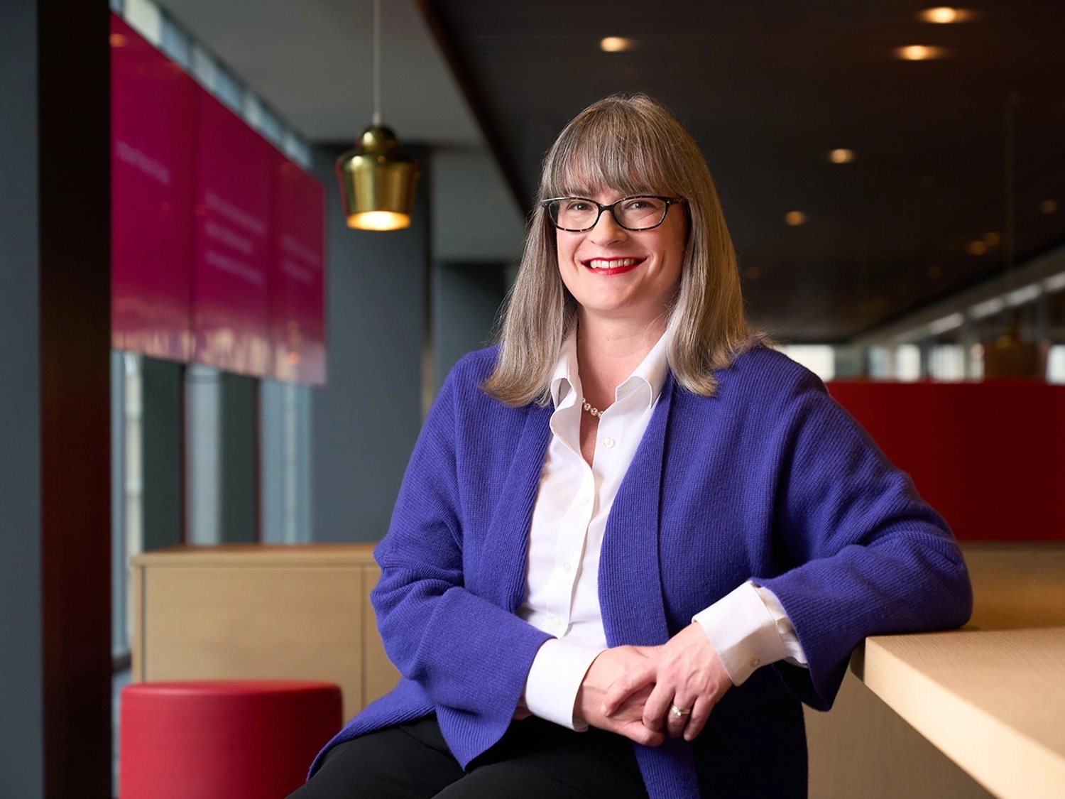 A professional portrait of Elizabeth Collins in the Chicago Morningstar office.