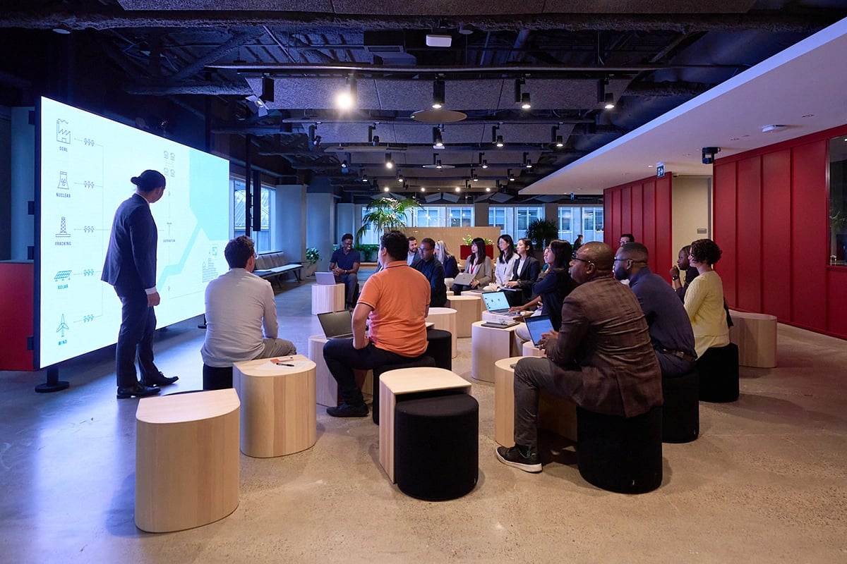 Employees meeting in a conference room at a Morningstar office.